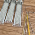 Customer installation of drink pusher with divider tracks for beverage display.