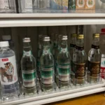 Shelf pusher installation holding yogurt and beverage products.