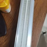 Shelf pusher system shown organizing yogurt, juice, and milk products.