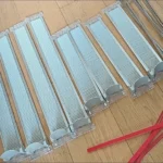 User-shared image of drink pusher organizing mixed beverage sizes in fridge.