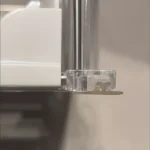 Customer photo of shelf pusher system installed in refrigerator organizing beverage cans.