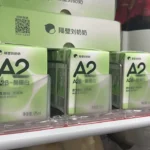 Customer photo showing shelf pushers installed for retail drink merchandise.